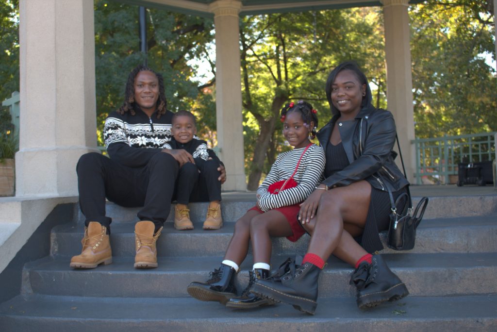 Deamonta Williams and his family pose for a portrait at Washington Park